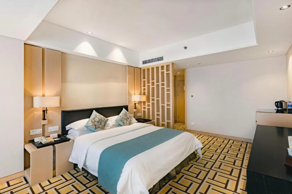 Bed in New Century Pujiang Hotel