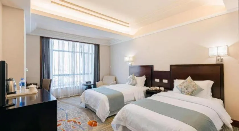 Bed in New Century Pujiang Hotel