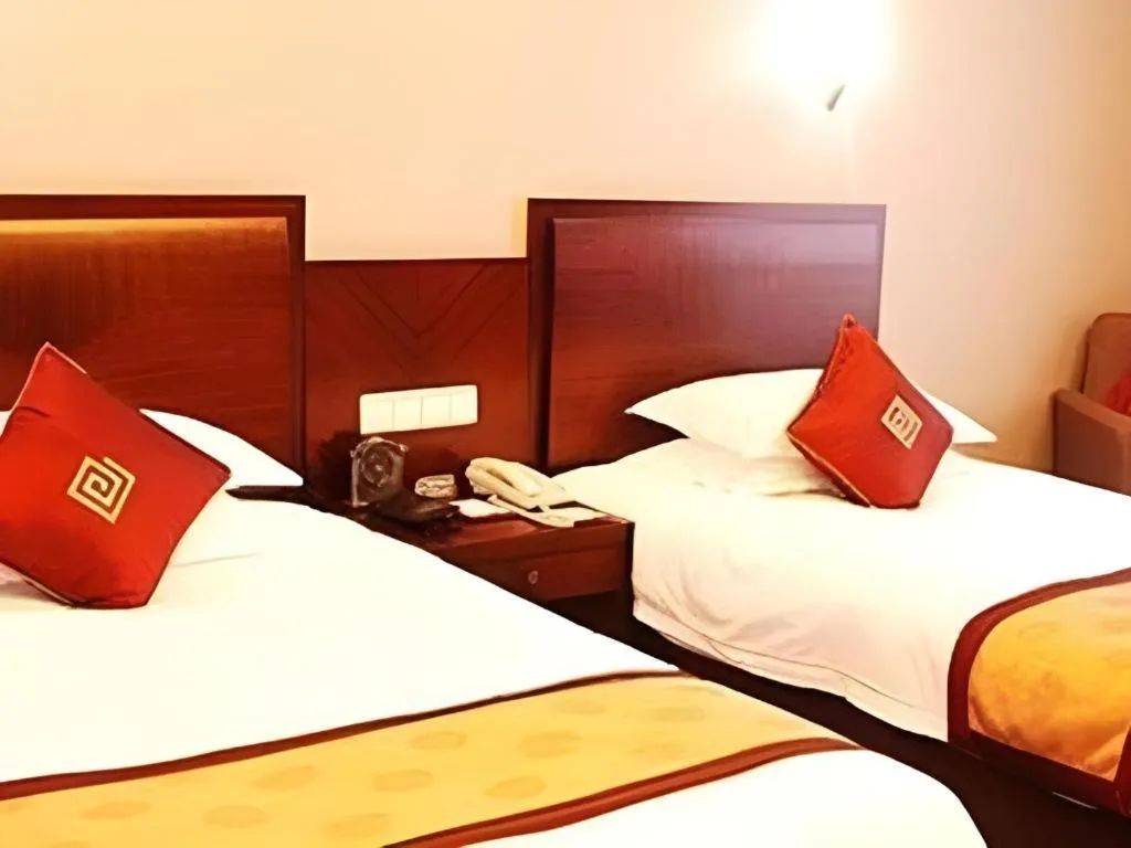 Bed in New Century Pujiang Hotel