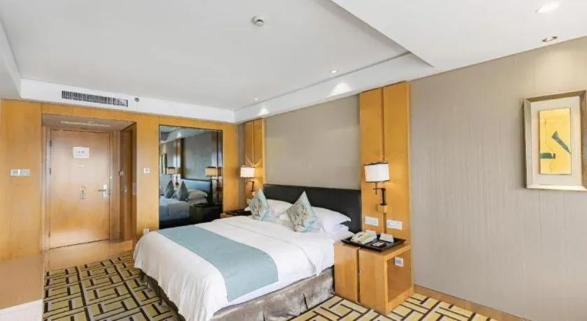Bed in New Century Pujiang Hotel