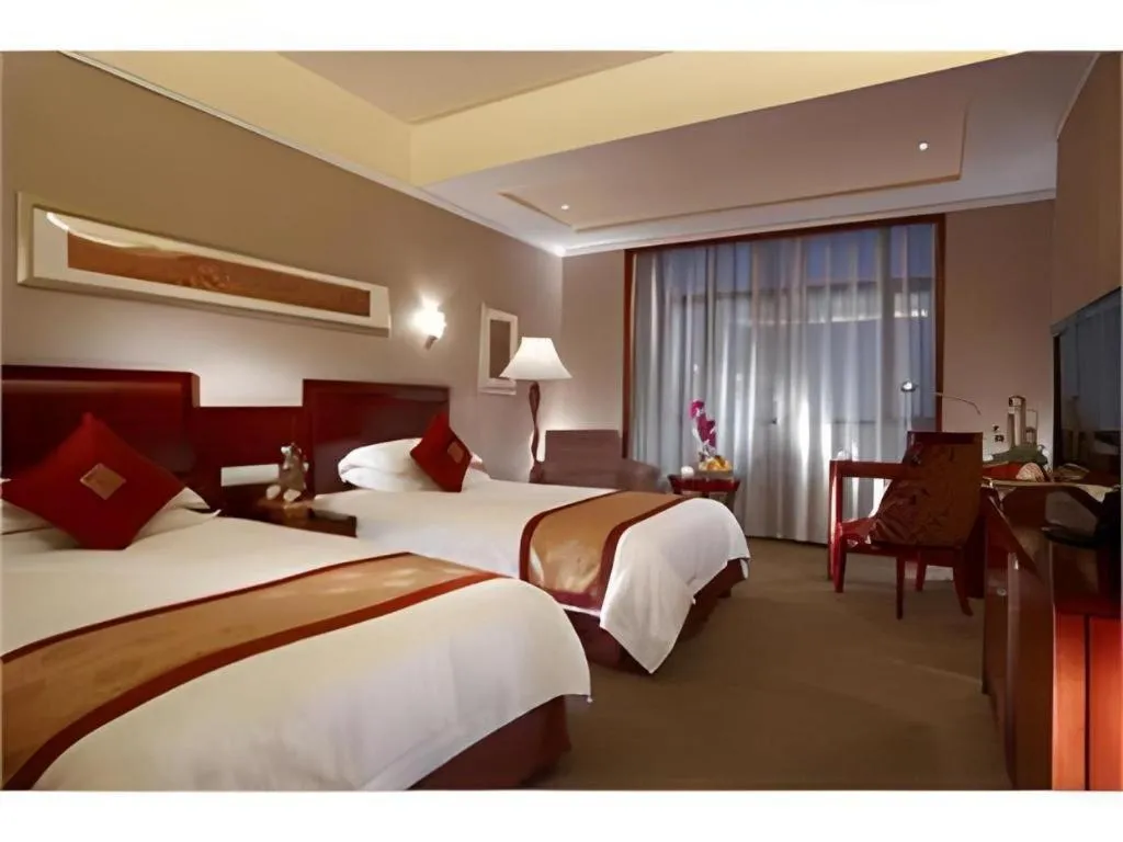 Bed in New Century Pujiang Hotel