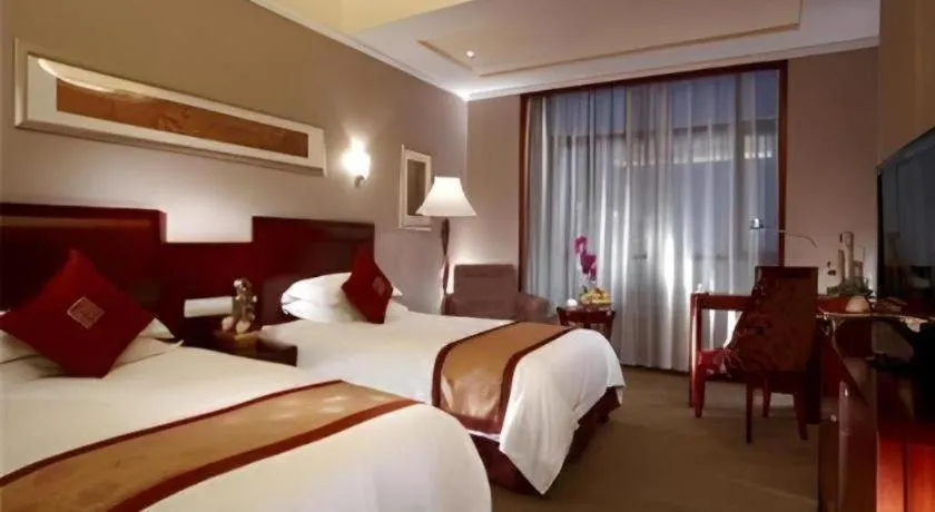 Bed in New Century Pujiang Hotel