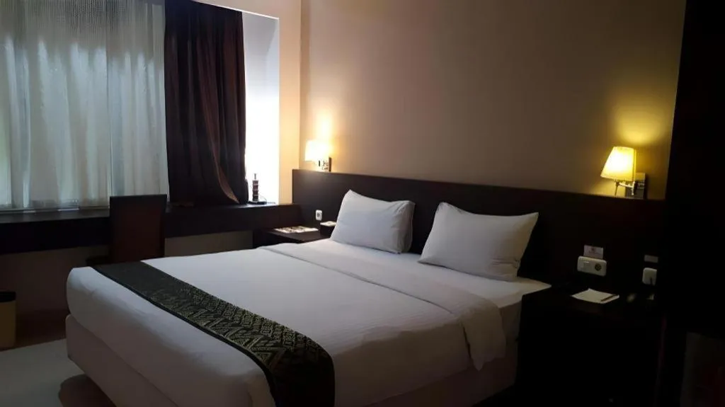 Bed in Grand Hawaii Hotel Pekanbaru