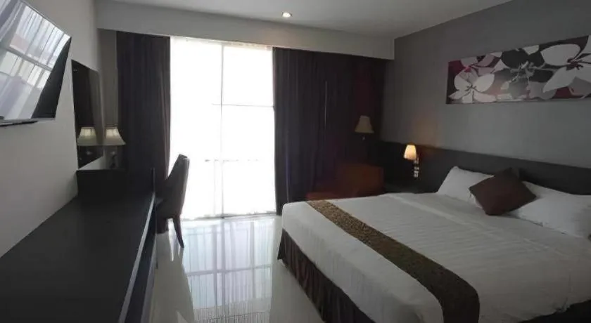 Bed in Grand Hawaii Hotel Pekanbaru