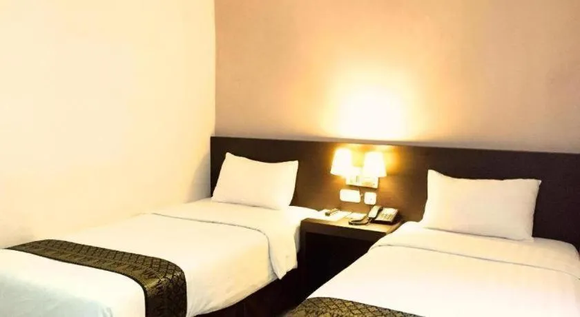 Bed in Grand Hawaii Hotel Pekanbaru