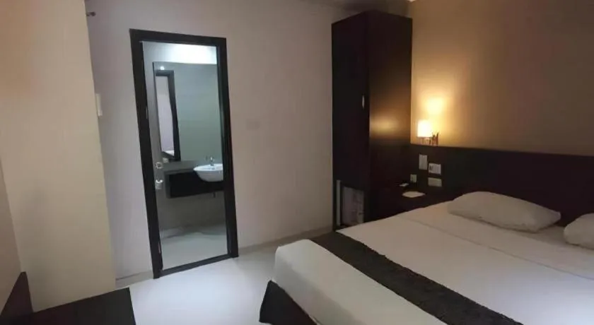 Bed in Grand Hawaii Hotel Pekanbaru