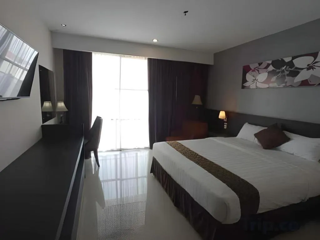 Bed in Grand Hawaii Hotel Pekanbaru