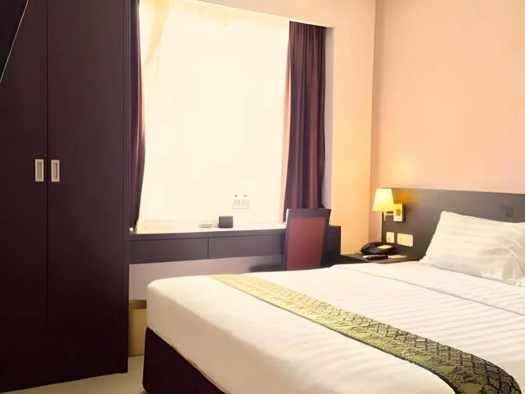 Bed in Grand Hawaii Hotel Pekanbaru