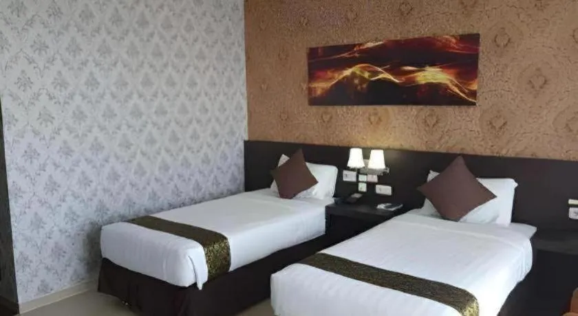 Bed in Grand Hawaii Hotel Pekanbaru