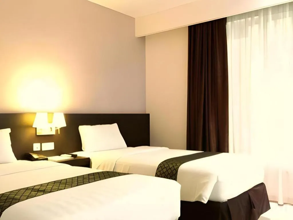 Bed in Grand Hawaii Hotel Pekanbaru