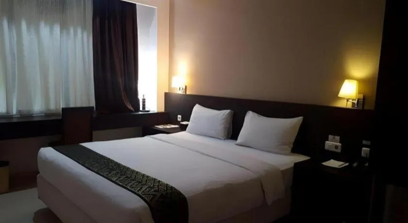 Bed in Grand Hawaii Hotel Pekanbaru