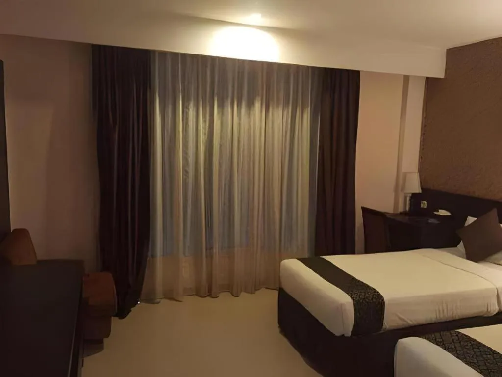 Bed in Grand Hawaii Hotel Pekanbaru