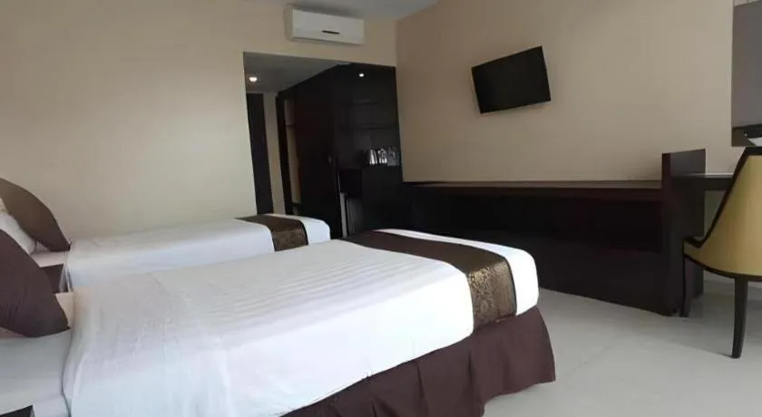 Bed in Grand Hawaii Hotel Pekanbaru