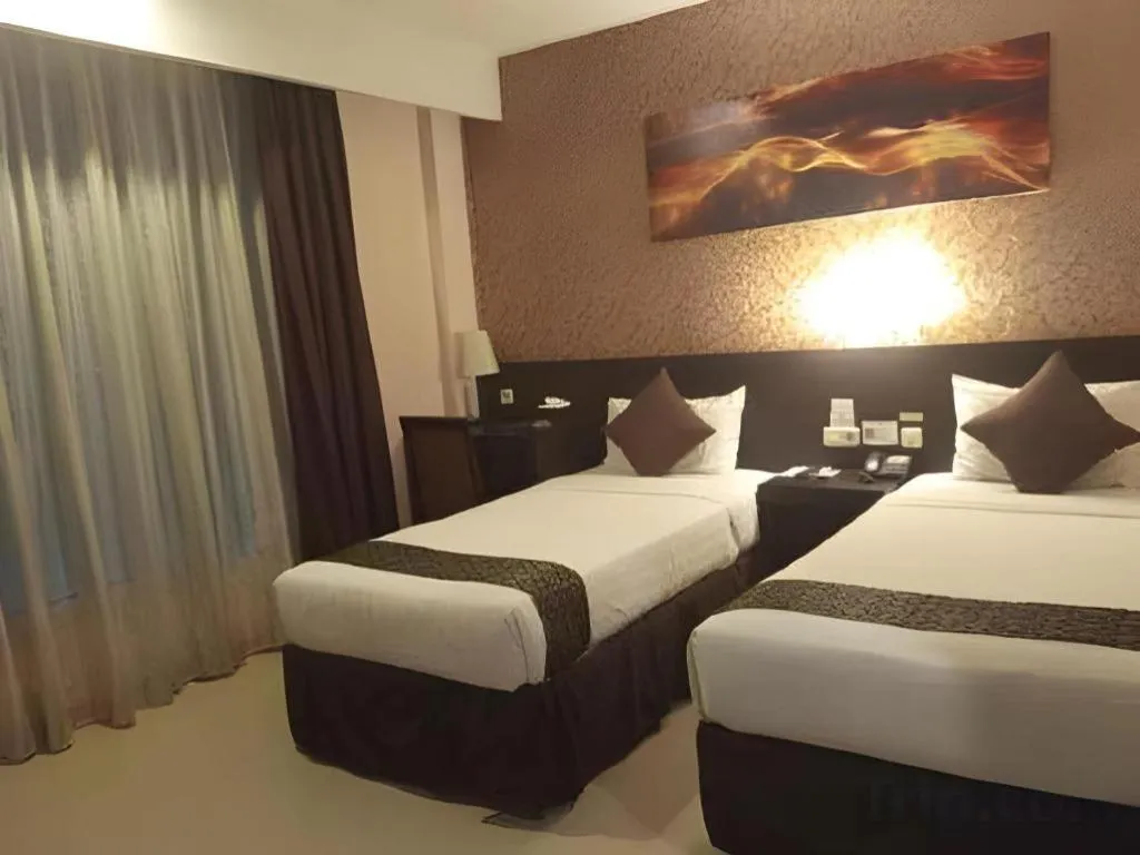 Bed in Grand Hawaii Hotel Pekanbaru