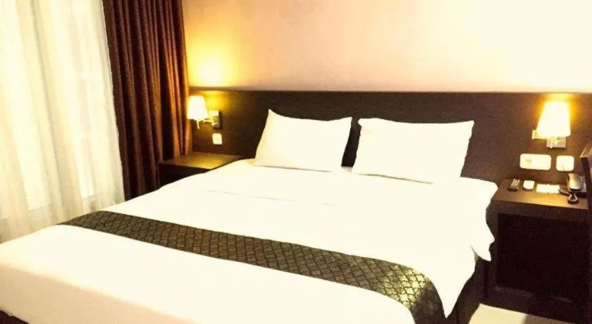 Bed in Grand Hawaii Hotel Pekanbaru