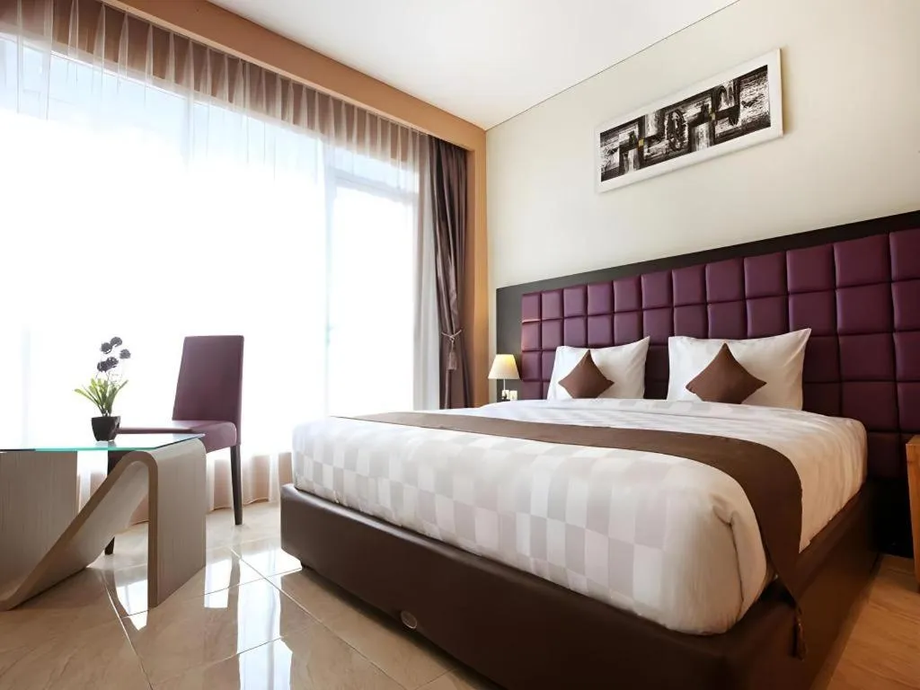 Bed in Asoka Luxury Hotel