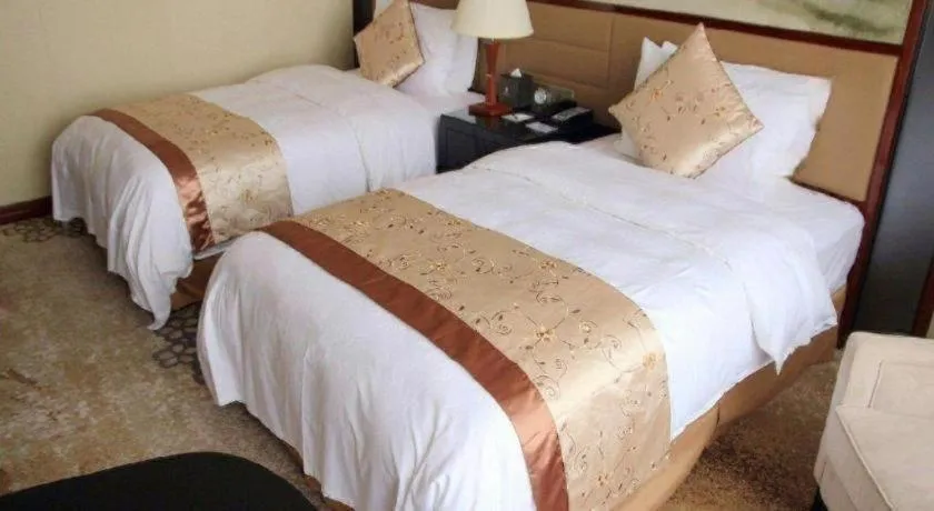 Bed in Yang Peng Jin Jiang Hotel