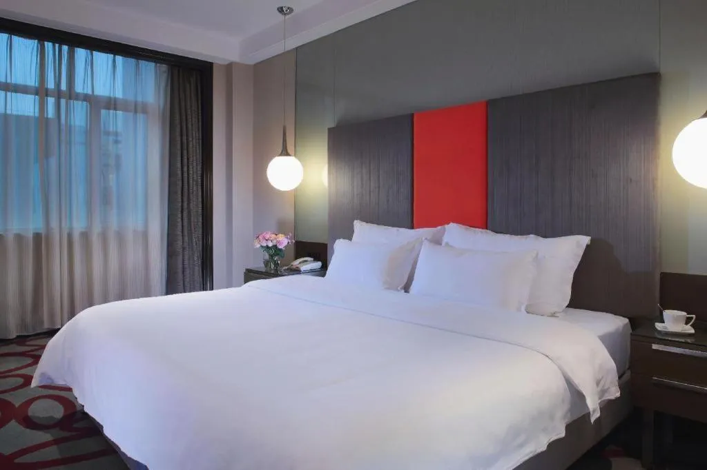 Bed in Dongguan Silver World Garden Hotel