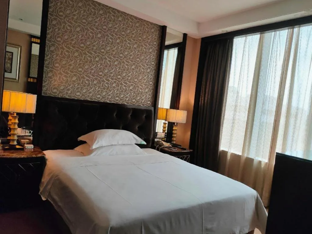Bed in Dongguan Silver World Garden Hotel
