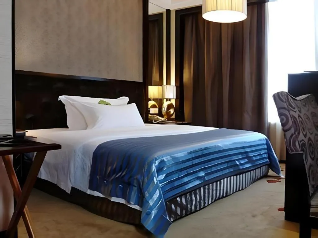Bed in Dongguan Silver World Garden Hotel