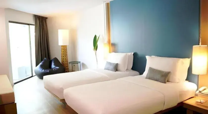 Bed in Ramada by Wyndham Phuket Southsea Bed in Ramada by Wyndham Phuket Southsea