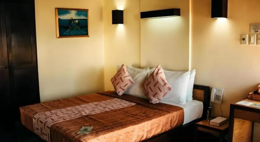 Bed in Kahuna Beach Resort and Spa