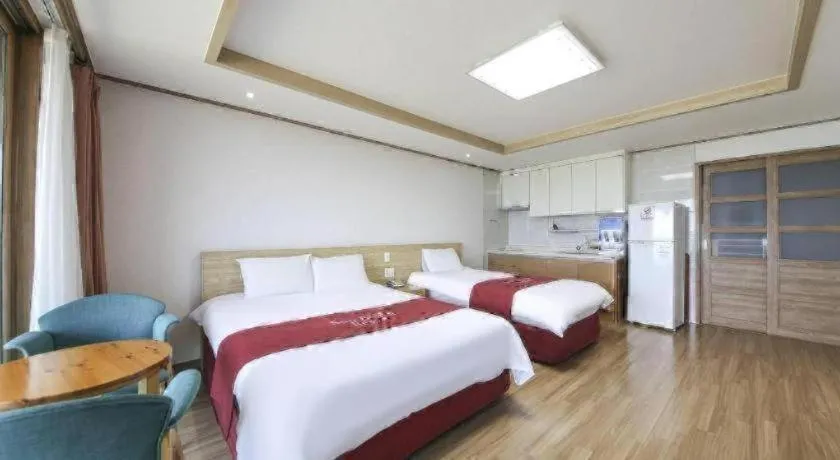 Bed in Jeju Sunbeach Hotel & Resort
