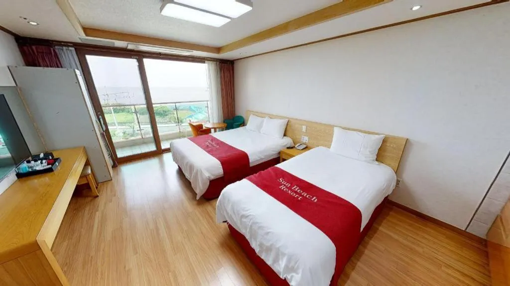 Bed in Jeju Sunbeach Hotel & Resort