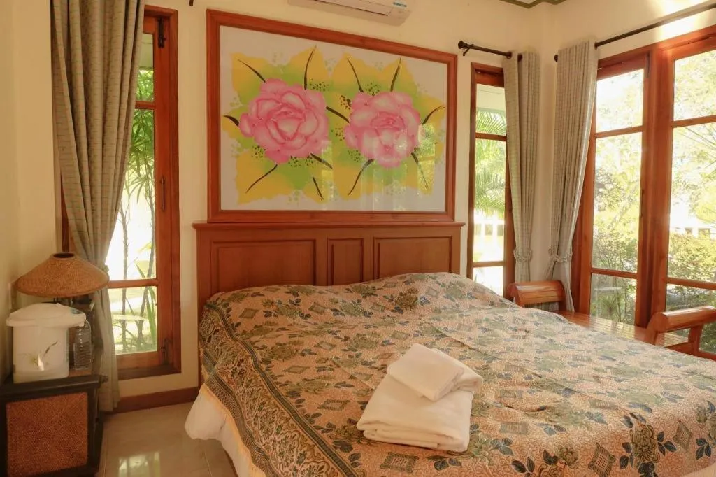 Bed in THAISOMBOON BIGHOME RESORT