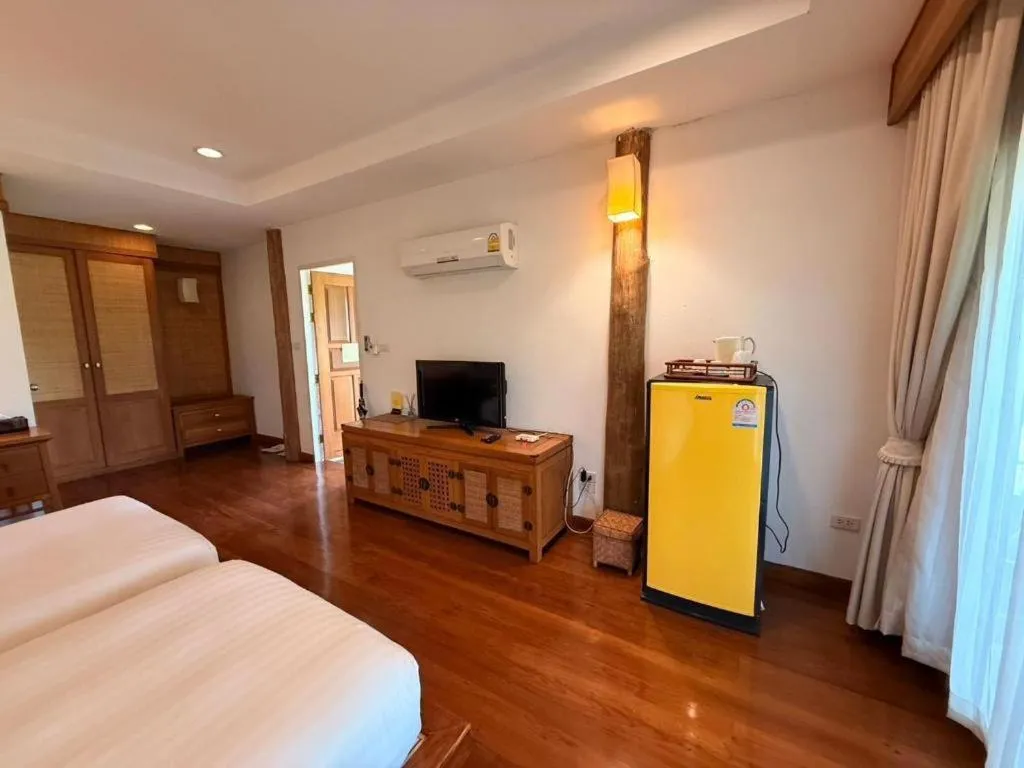 Bed in Chiangkham Luang Resort