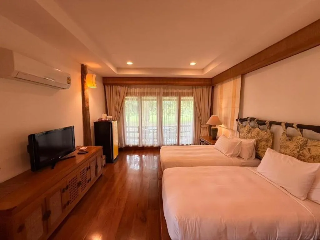 Bed in Chiangkham Luang Resort