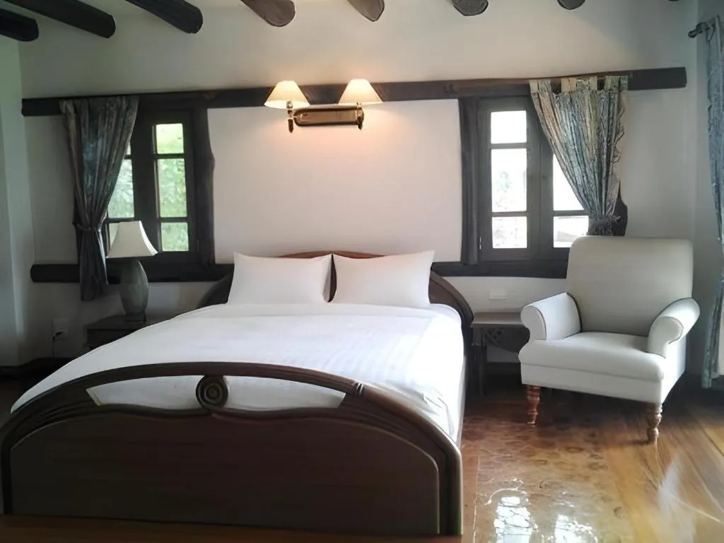 Bed in Chiangkham Luang Resort