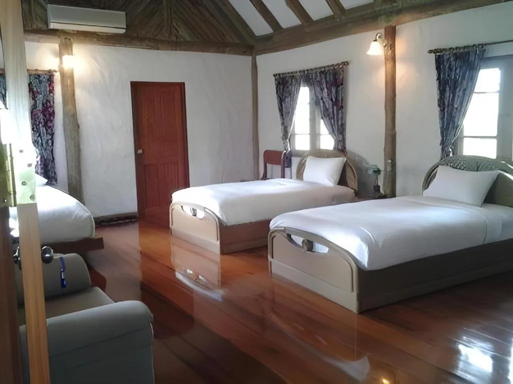 Bed in Chiangkham Luang Resort