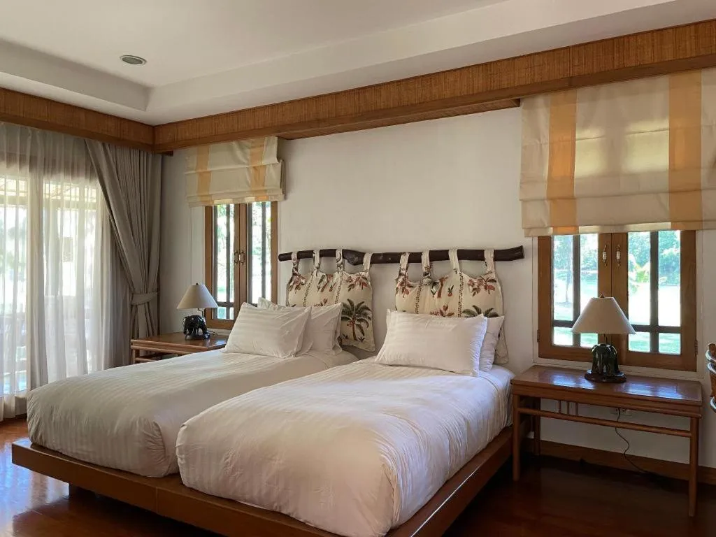 Bed in Chiangkham Luang Resort