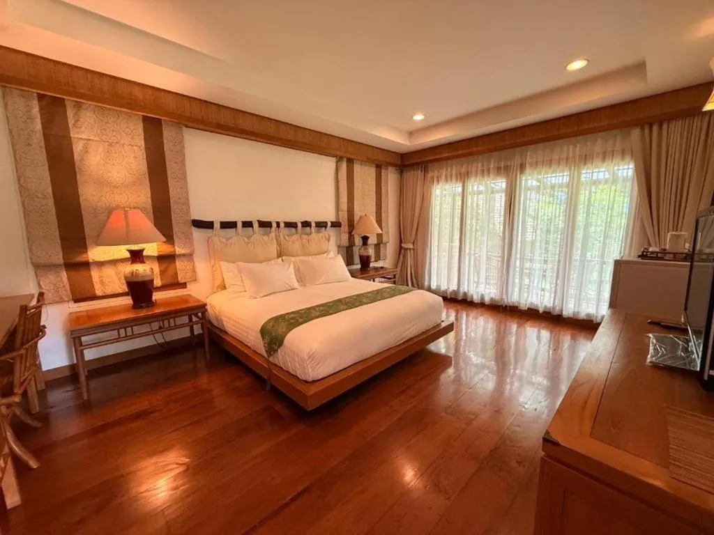 Bed in Chiangkham Luang Resort