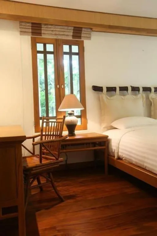 Bed in Chiangkham Luang Resort