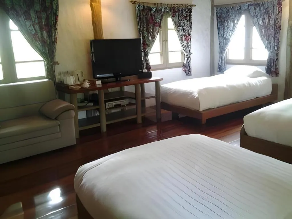 Bed in Chiangkham Luang Resort