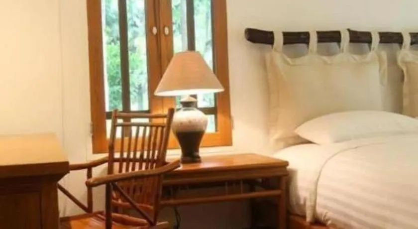 Bed in Chiangkham Luang Resort