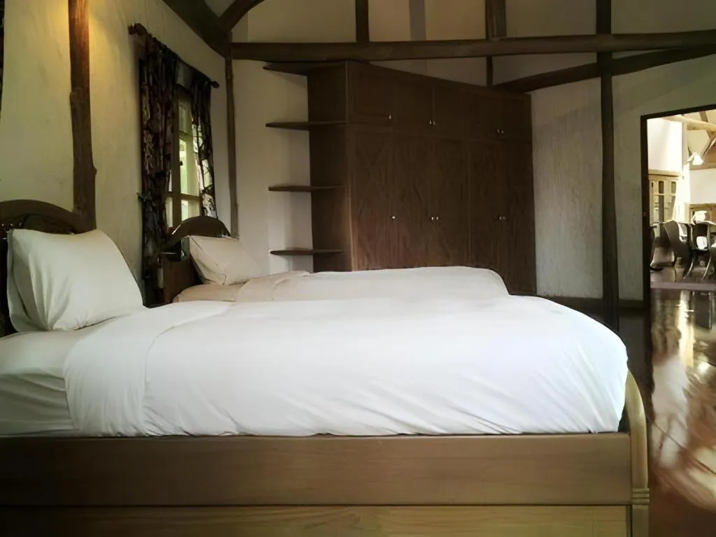 Bed in Chiangkham Luang Resort