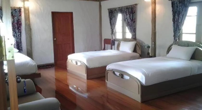 Bed in Chiangkham Luang Resort