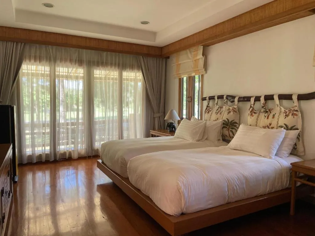 Bed in Chiangkham Luang Resort