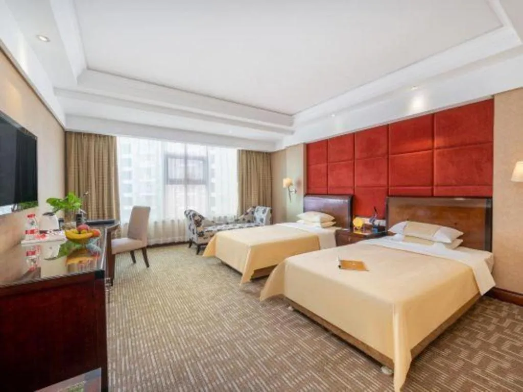 Bed in Chinflux Mandarin Hotel