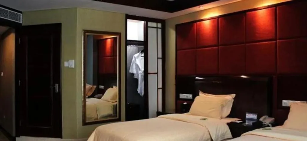 Bed in Chinflux Mandarin Hotel