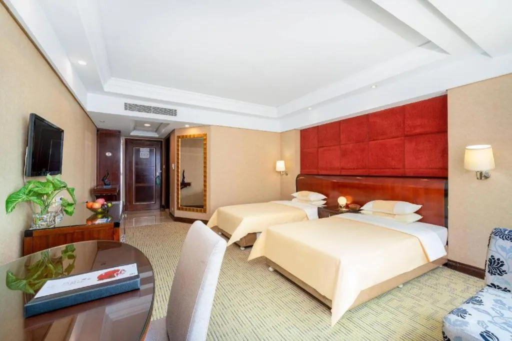 Bed in Chinflux Mandarin Hotel