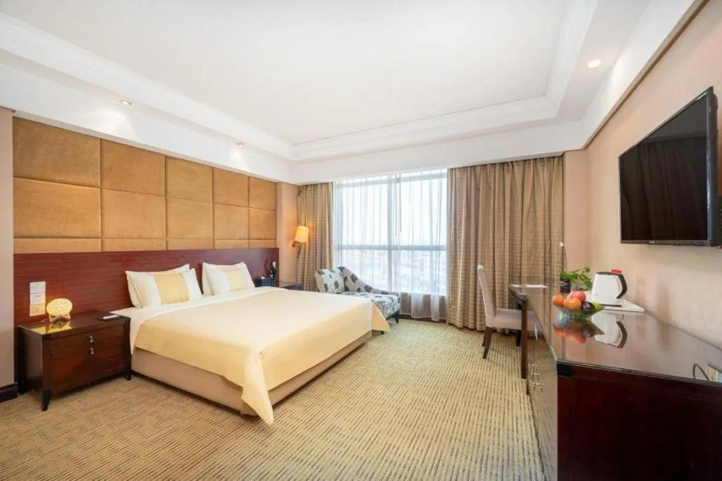 Bed in Chinflux Mandarin Hotel