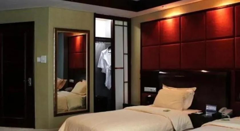 Bed in Chinflux Mandarin Hotel