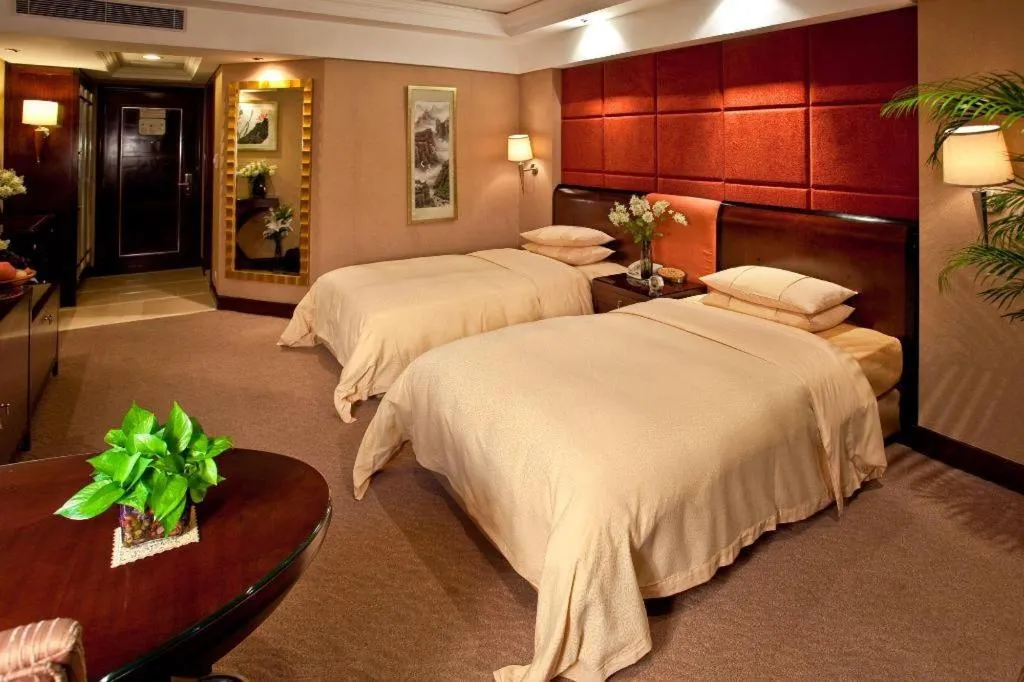 Bed in Chinflux Mandarin Hotel