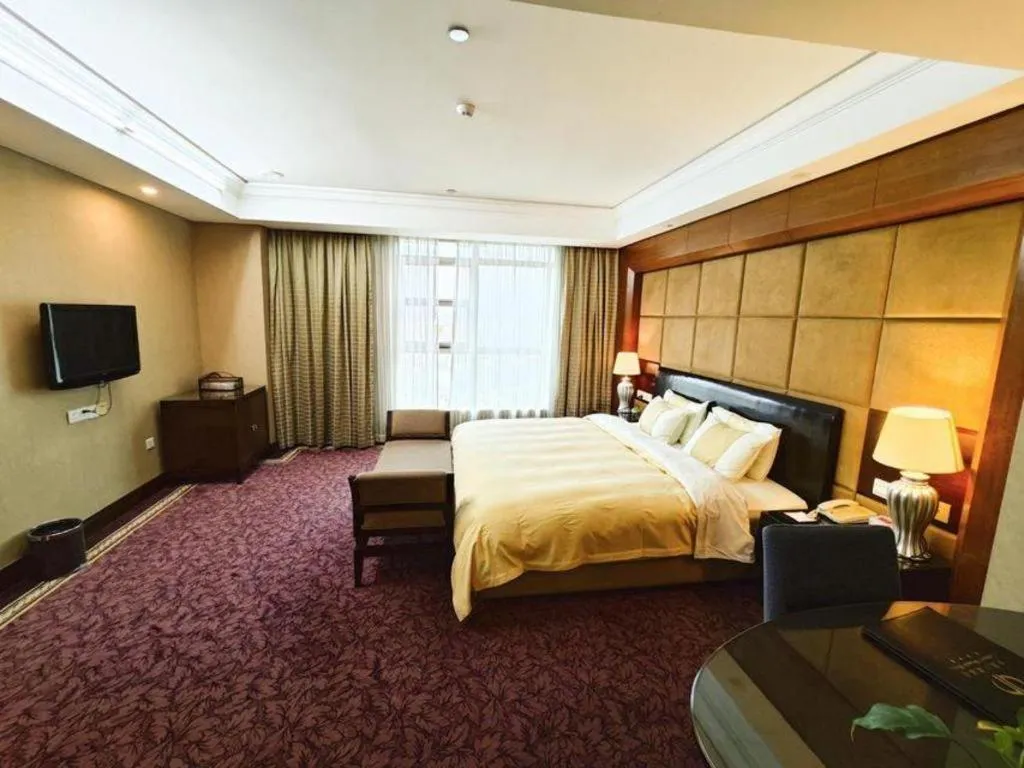 Bed in Chinflux Mandarin Hotel