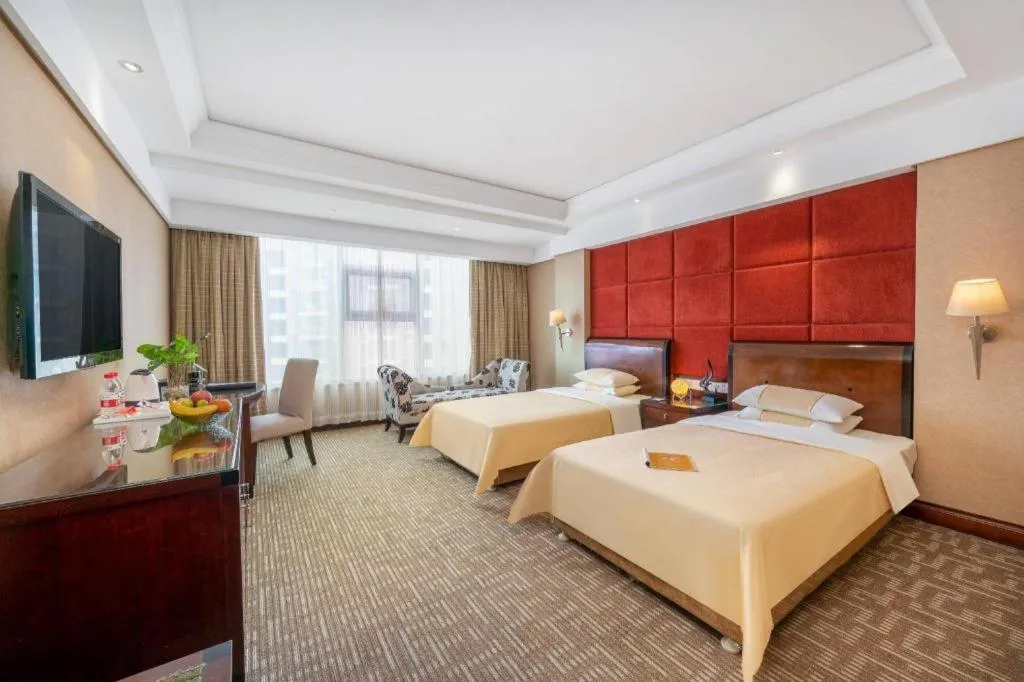 Bed in Chinflux Mandarin Hotel