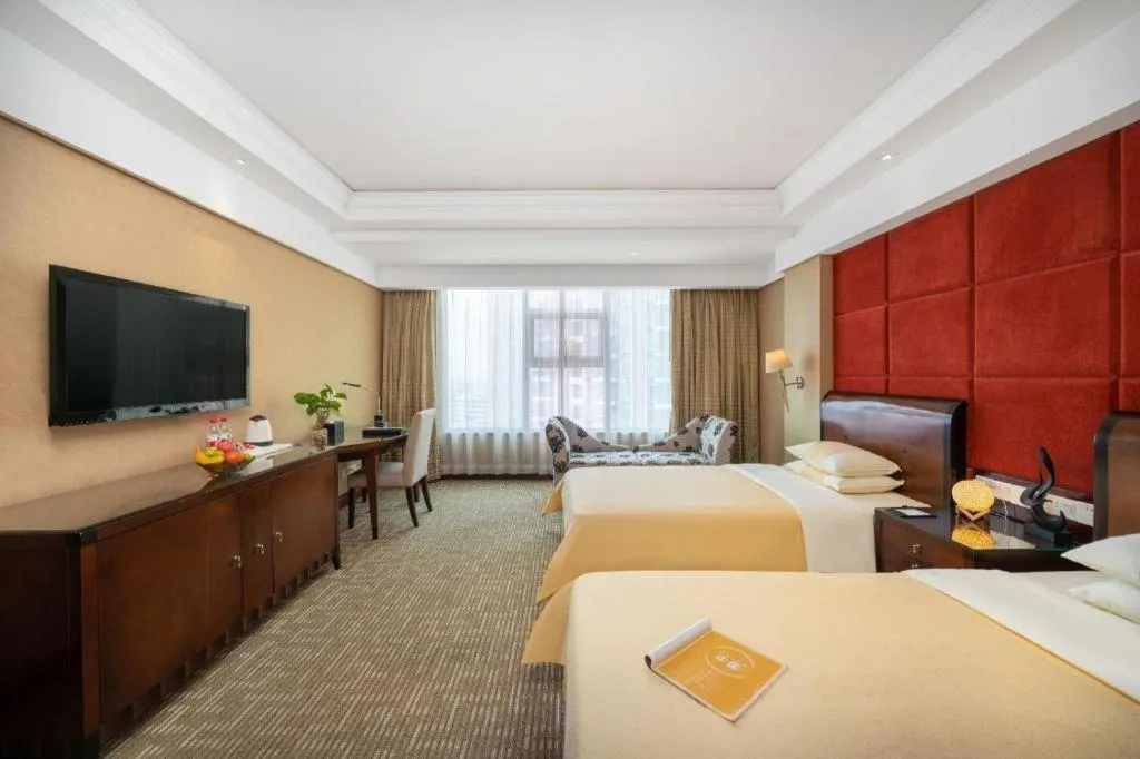 Bed in Chinflux Mandarin Hotel